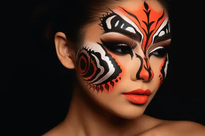 Portrait Of A Woman With Artistic Butterfly Face Paint