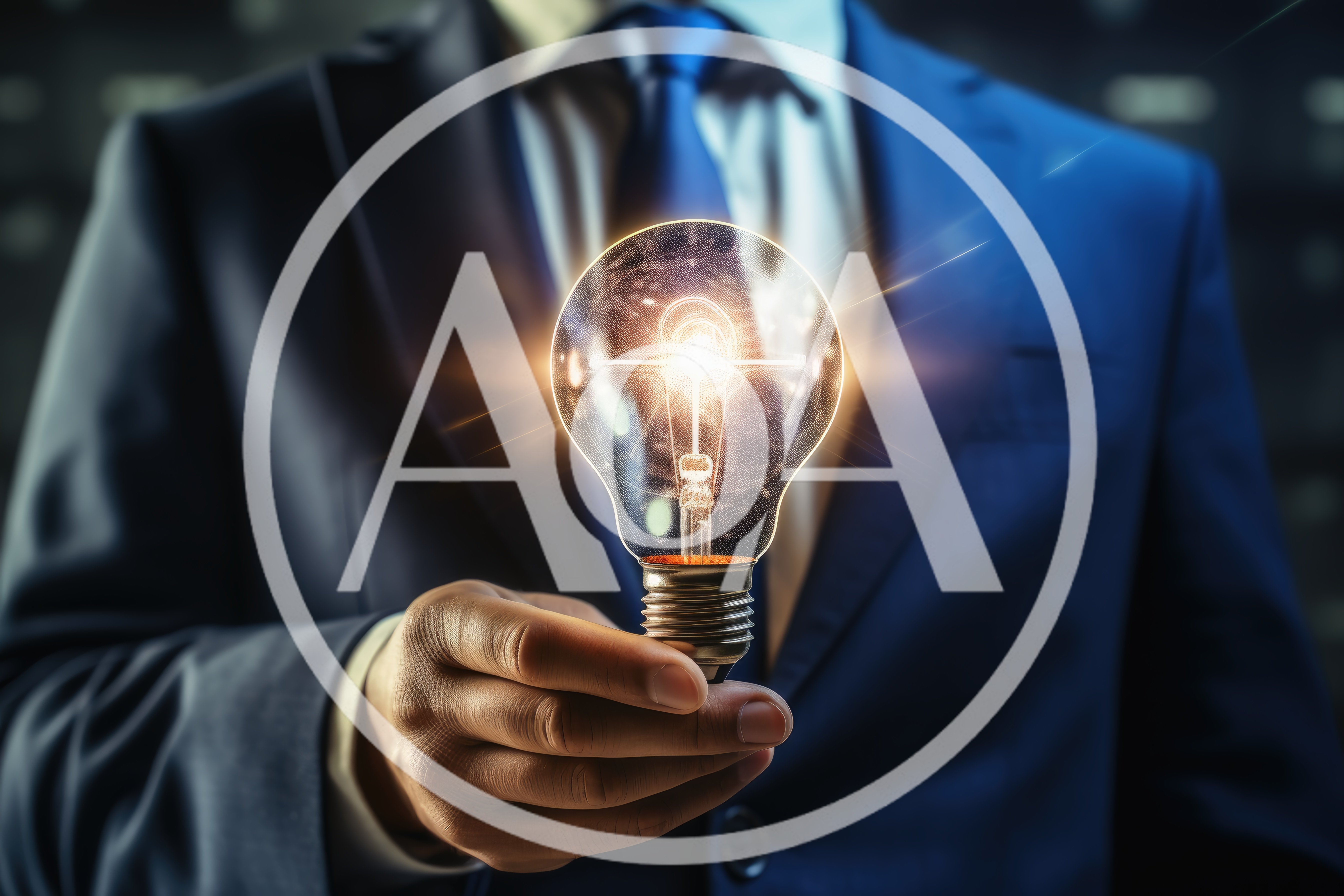 Businessman Holding A Glowing Light Bulb Concept