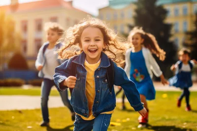 Happy School Children Running Outdoors Together