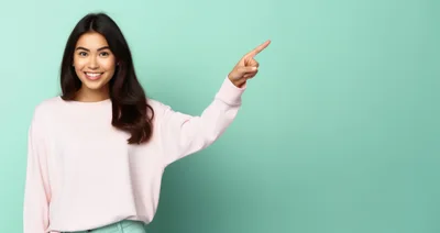 Smiling Young Woman Pointing To The Right