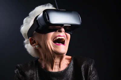 Elderly Woman Laughing While Wearing Virtual Reality Headset