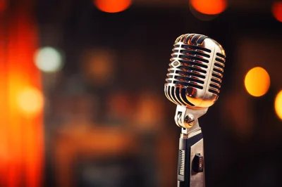 Vintage Silver Microphone On Stage With Bokeh Background
