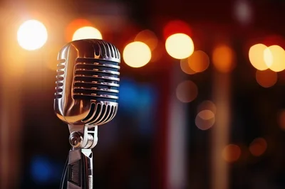 Vintage Silver Microphone On Stage With Bokeh Lights