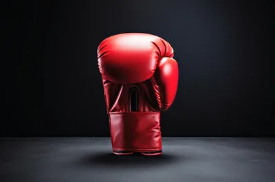 Single Red Boxing Glove on Dark Background