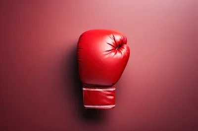 Single Red Boxing Glove on Solid Background