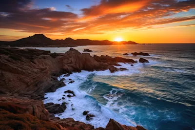 Dramatic Sunset Over Rocky Coastal Cliffs And Ocean