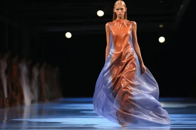 Fashion Model Walking Down Runway In Futuristic Dress