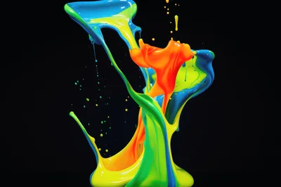 Vibrant Multi-Colored Paint Splash Against Black Background