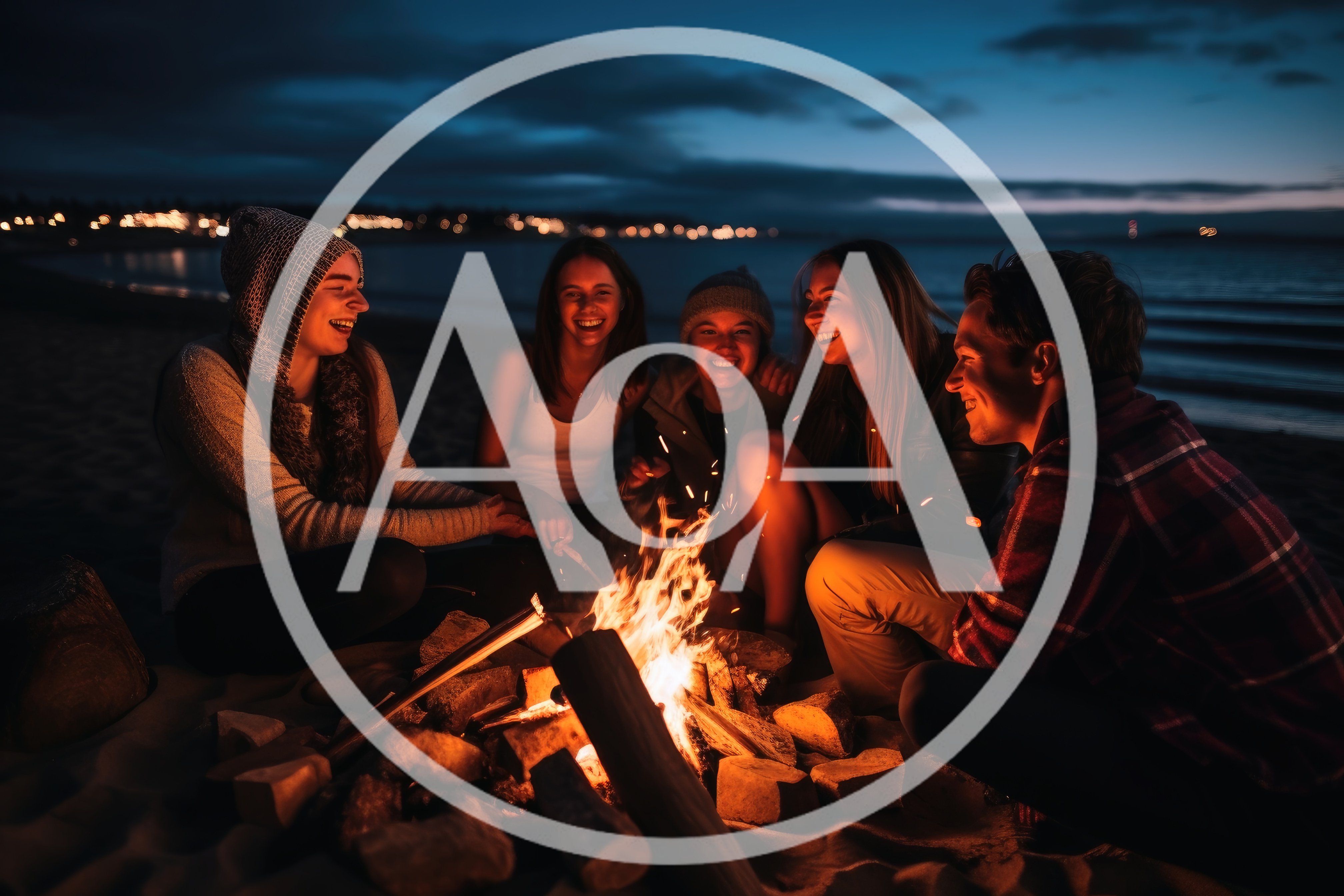 Friends Enjoying A Beach Bonfire At Twilight