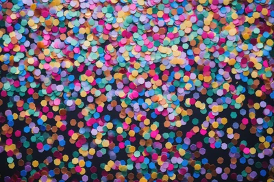 Colorful Hexagonal Confetti Scattered On Black Background