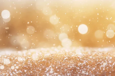 Golden Glittering Background With Falling Snow Particles