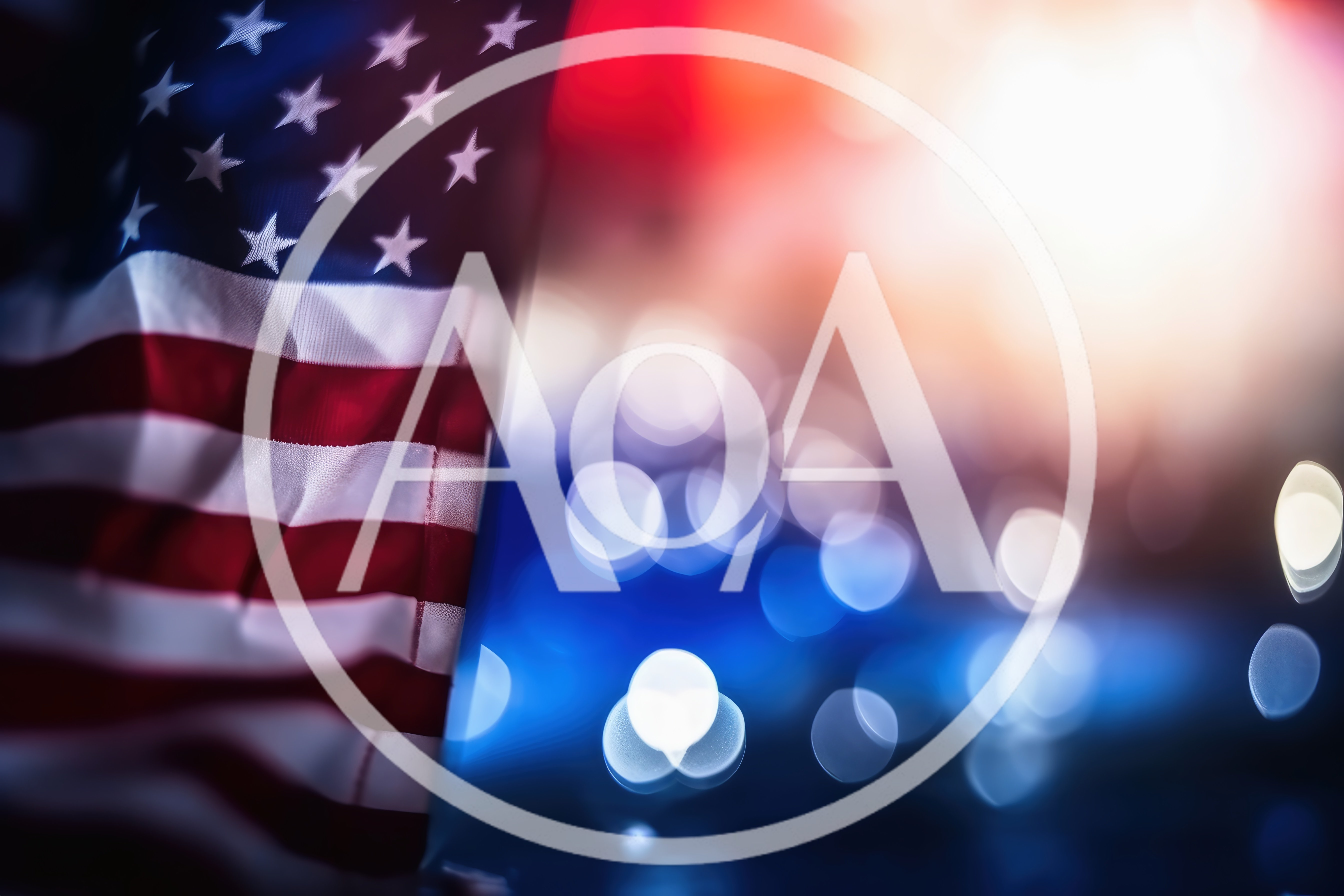 American Flag Waving Against Blurred City Lights
