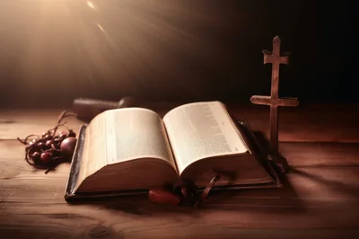 Open Holy Bible With Cross On Wooden Table