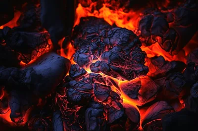 Glowing Hot Charcoal Embers In A Fire Pit