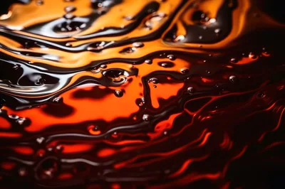 Abstract Liquid Swirls of Orange and Black Oil