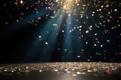 Colorful Confetti Falling On A Dark Stage Floor