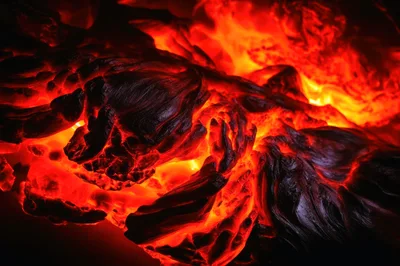 Molten Lava Flowing Over Volcanic Rock