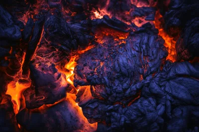 Glowing Hot Coals In A Dark Fireplace