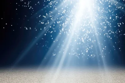 Abstract Blue Background With Glowing Light Rays And Particles