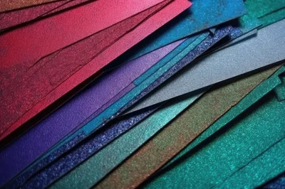 Abstract Background Of Layered Metallic Glitter Paper Sheets