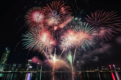 Spectacular Fireworks Display Over City Skyline At Night