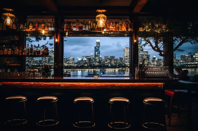 Empty Bar Counter Overlooking A City Skyline At Night