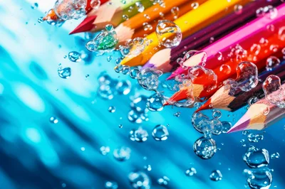Colored Pencils Submerged in Water with Bubbles