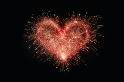 Sparkler Heart Shape Burning Against Black Background