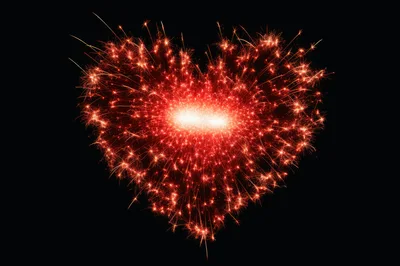 Sparkler Heart Shape Burning Against Black Background