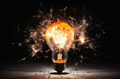 Light Bulb Exploding With Bright Sparks