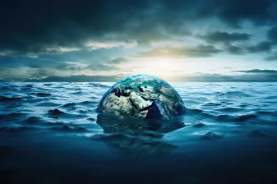 Earth Globe Partially Submerged In Deep Ocean Waters