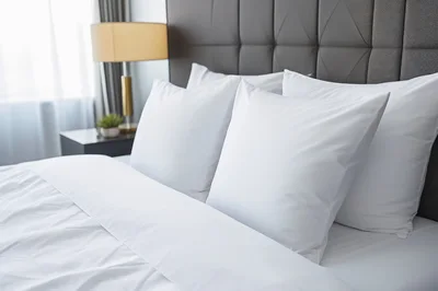 White Pillows On A Modern Hotel Bed