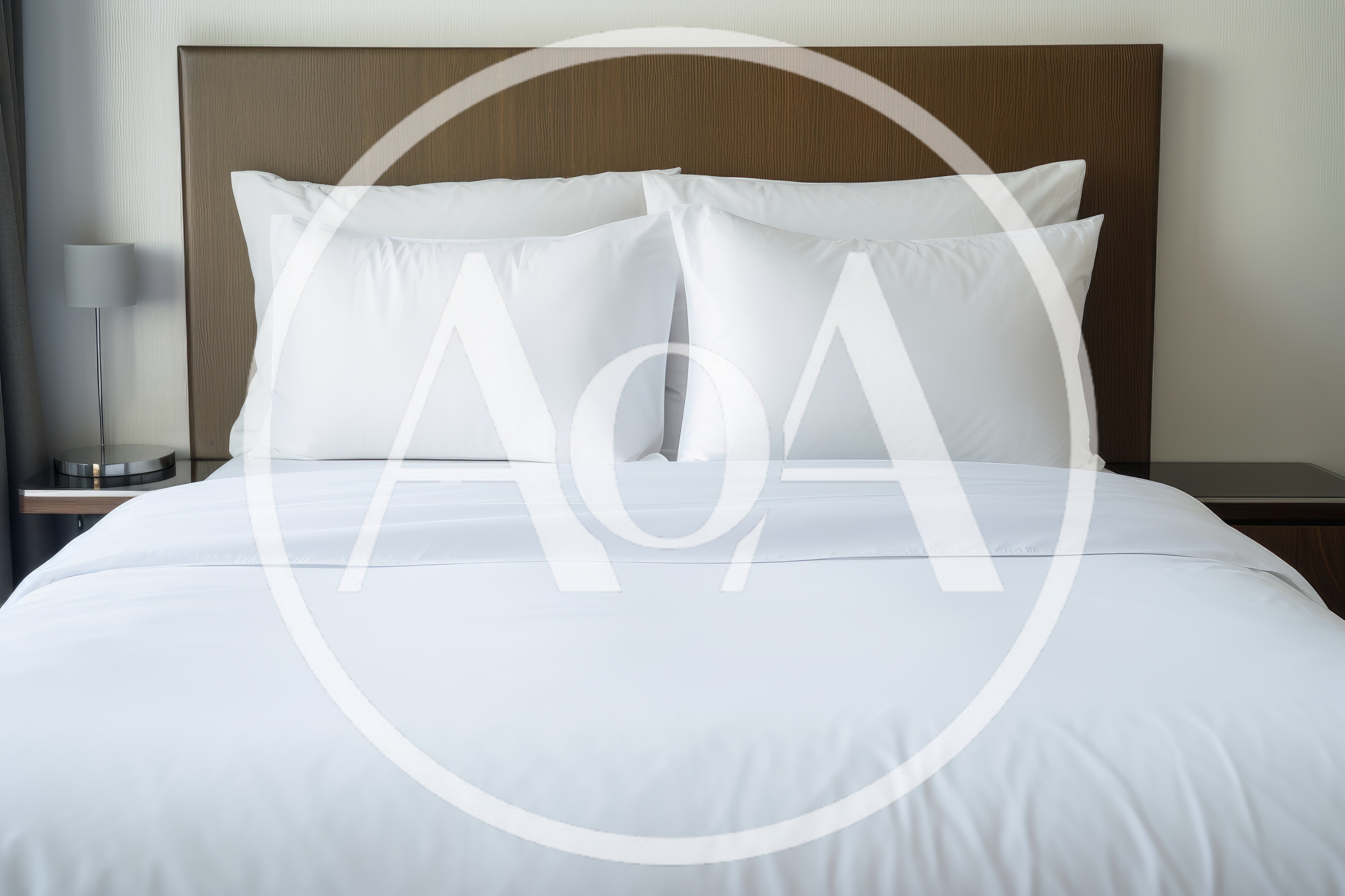 Modern Hotel Bed With White Linens And Pillows