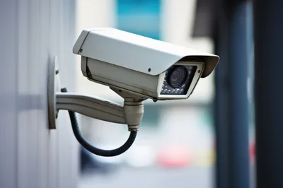 Outdoor Security Surveillance Camera Mounted On Building Wall