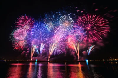 Vibrant Fireworks Display Over Calm Water