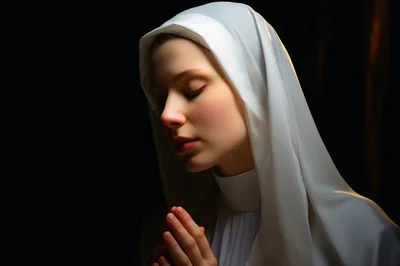 Young Nun Praying With Hands Clasped