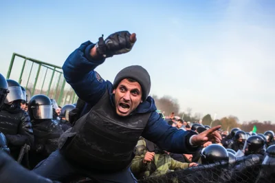 Protester Confronting Riot Police During Civil Unrest
