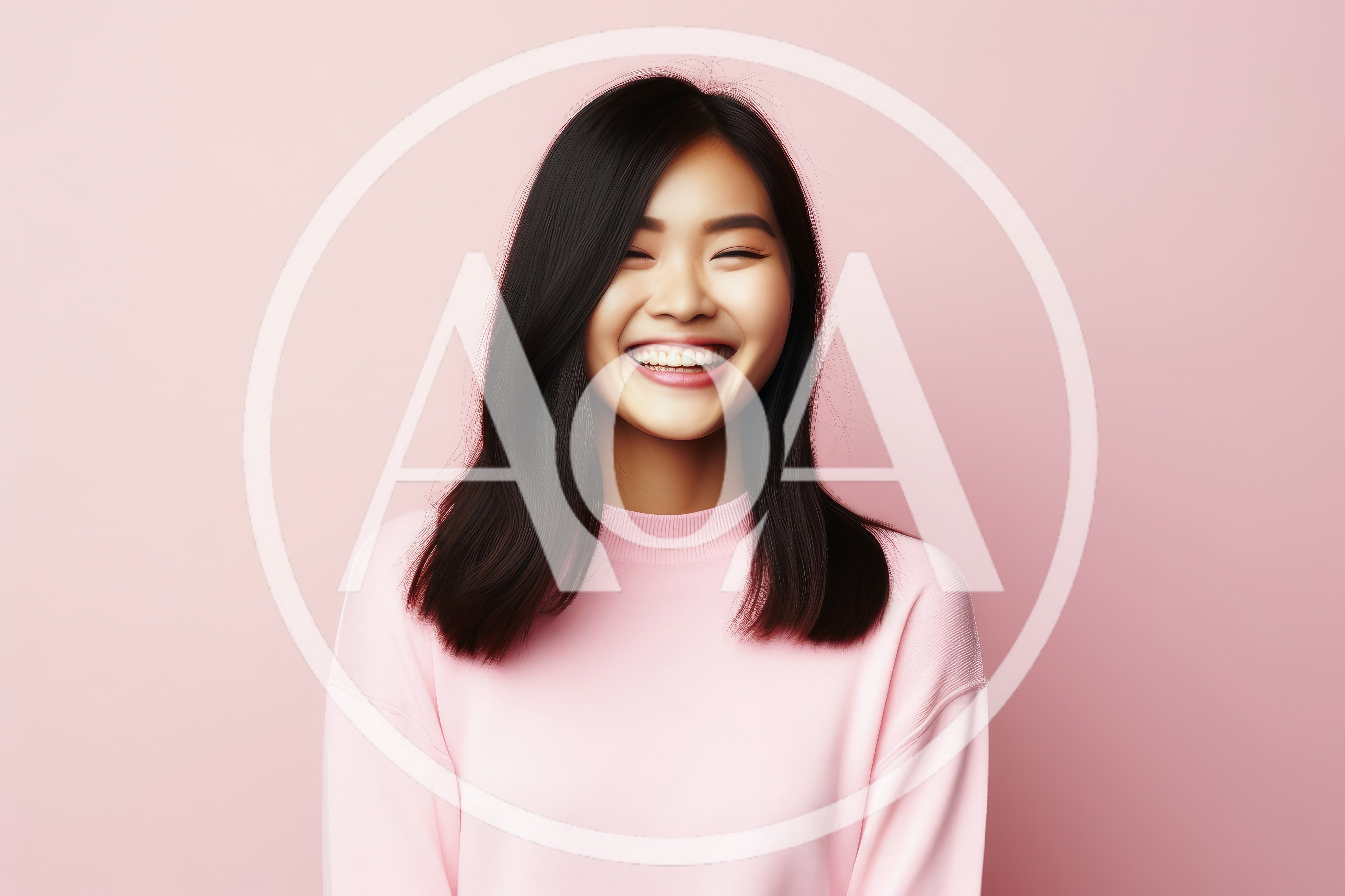 Young Asian Woman Laughing Against Pink Background