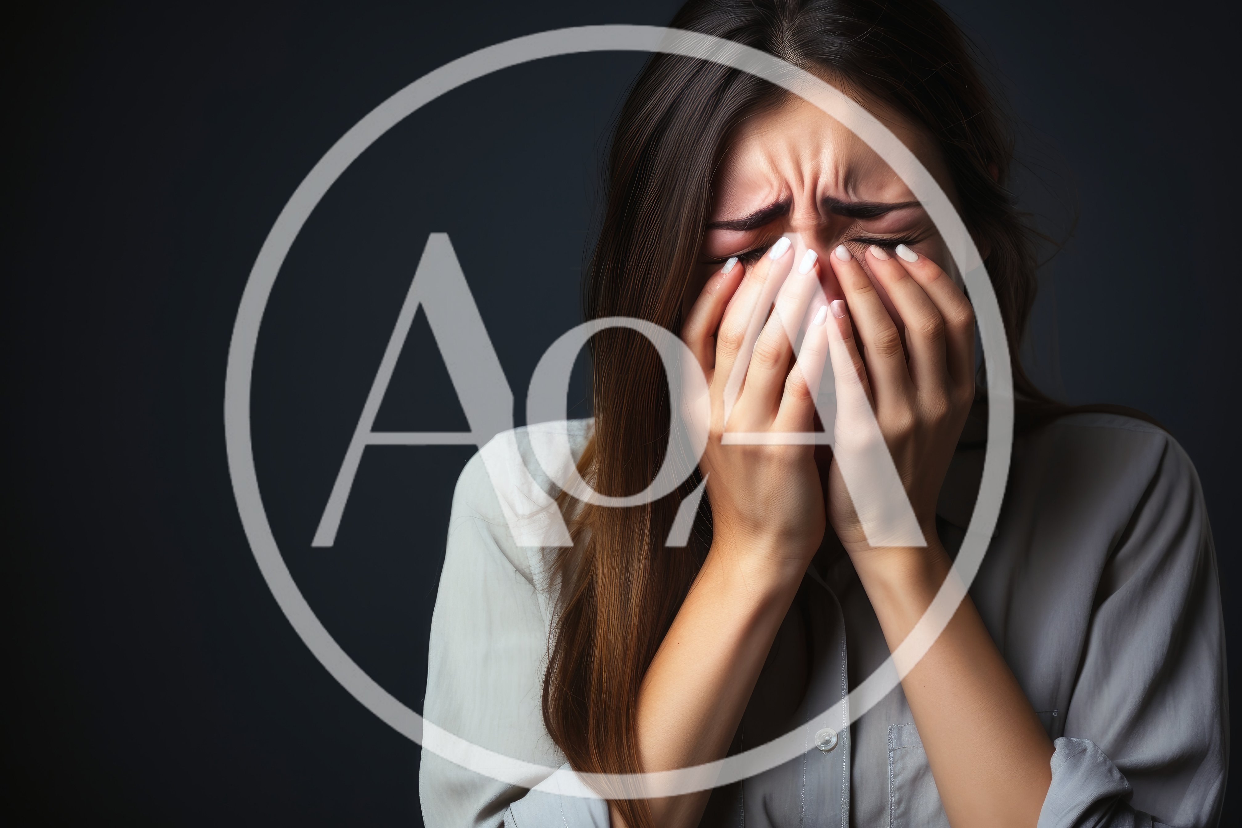Young Woman Crying With Hands Covering Her Face