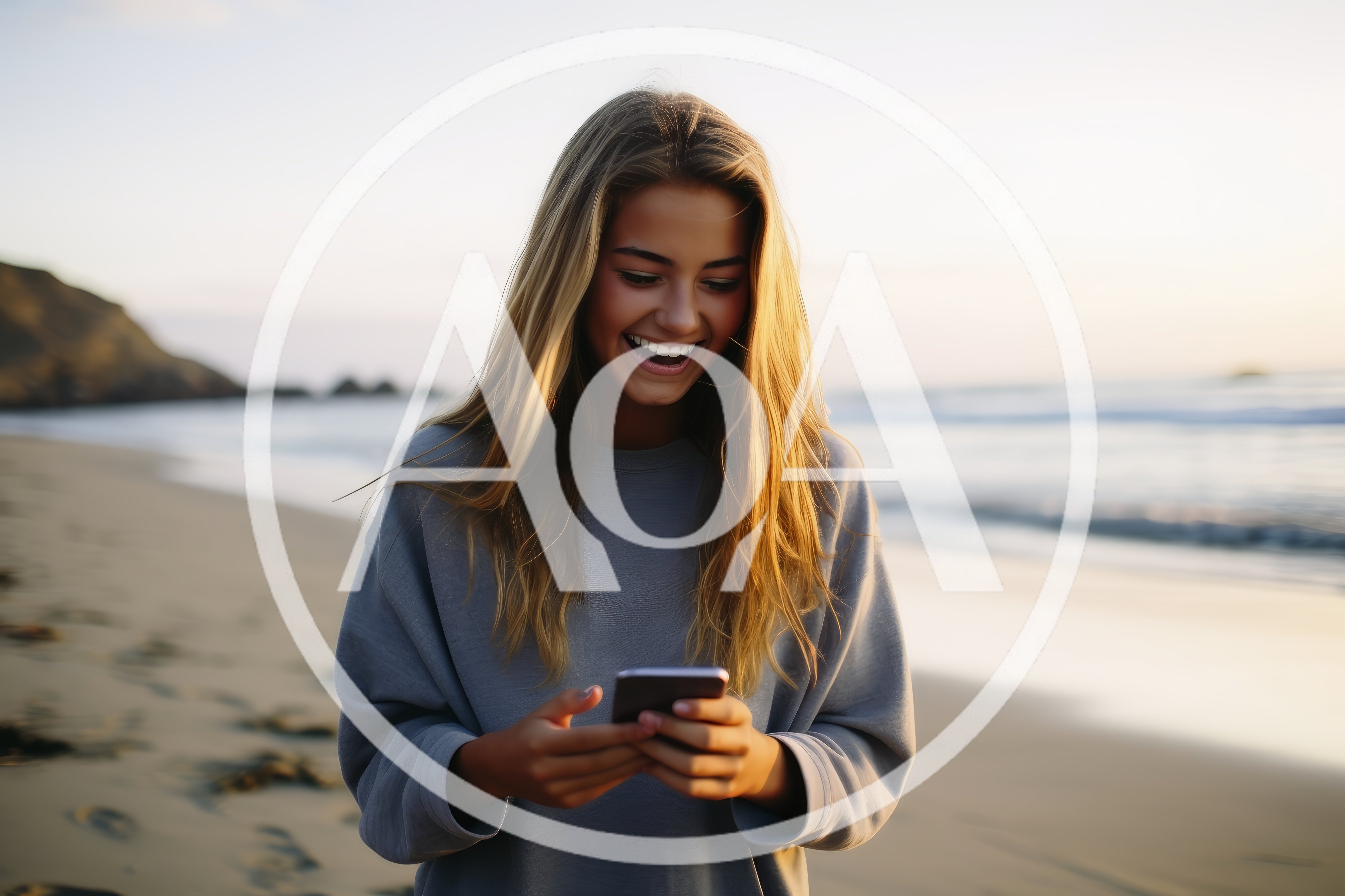 Young Woman Laughing While Using Smartphone On Beach
