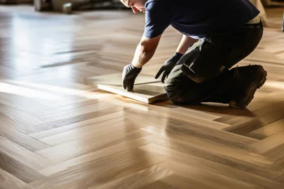 Professional Flooring Contractor Installing Herringbone Wood Floor