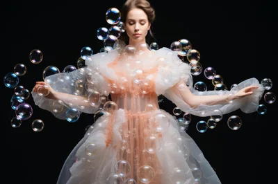 Elegant Woman In Tulle Dress Surrounded By Floating Bubbles