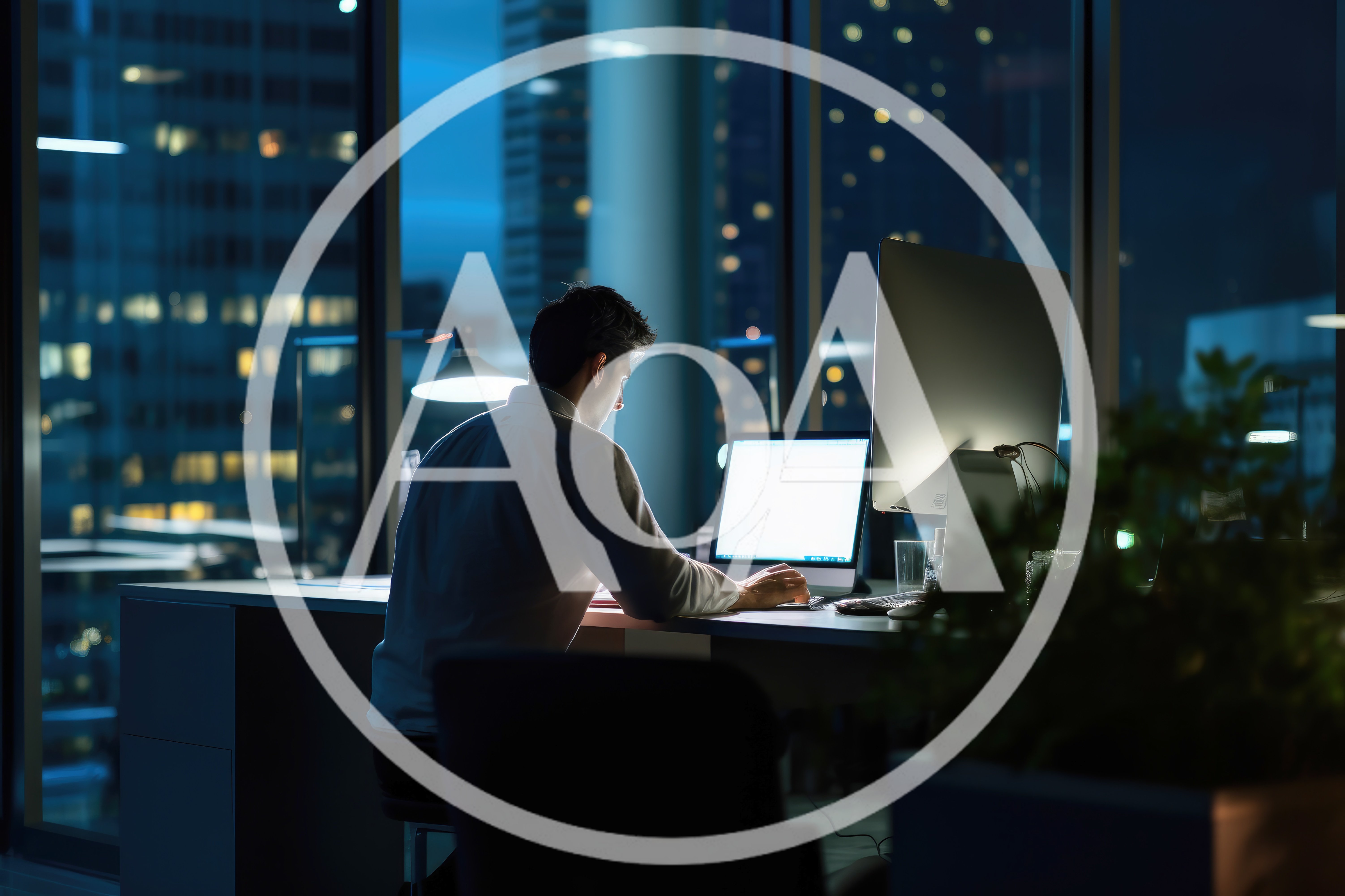 Businessman Working Late In A Modern Office At Night