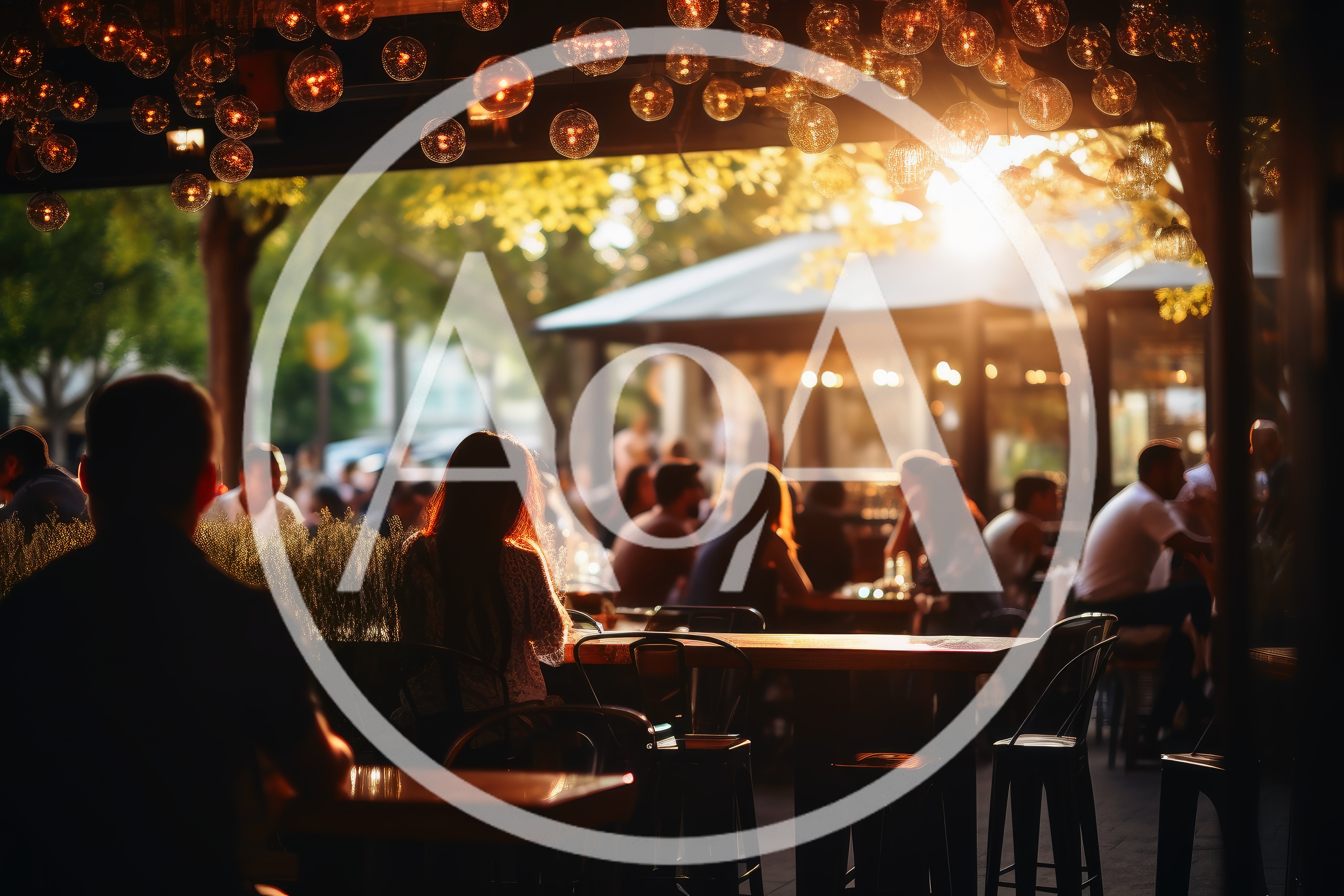 People Dining At An Outdoor Restaurant At Sunset