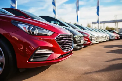 Row Of New Cars At A Dealership Lot