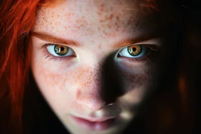 Close Up Portrait Of A Redheaded Girl With Freckles