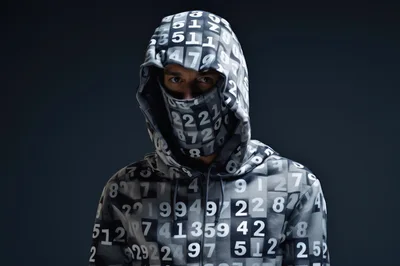 Man Wearing Number Patterned Hoodie And Face Mask