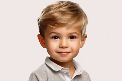 Portrait Of A Smiling Young Blonde Boy