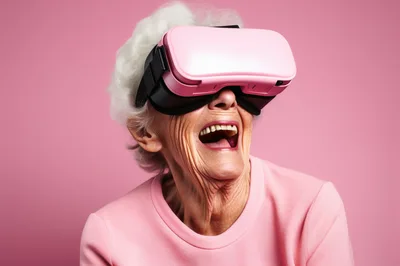 Elderly Woman Laughing While Wearing Virtual Reality Headset