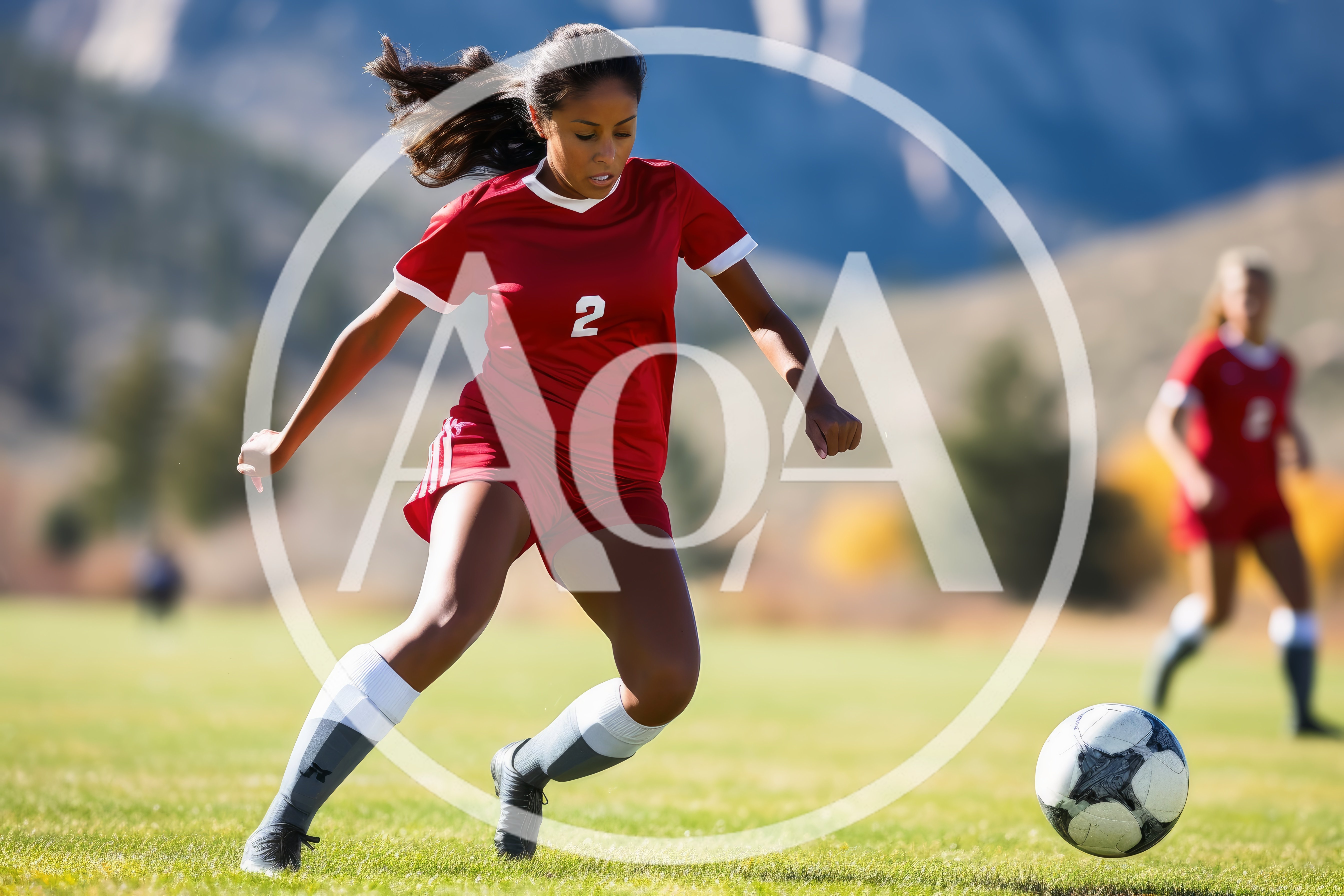 Female Soccer Player Dribbling Ball On Field